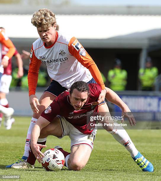 John-Joe O'Toole of Northampton Town under pressure from Cameron McGeehan of Luton Town during the Sky Bet League Two match between Northampton Town...