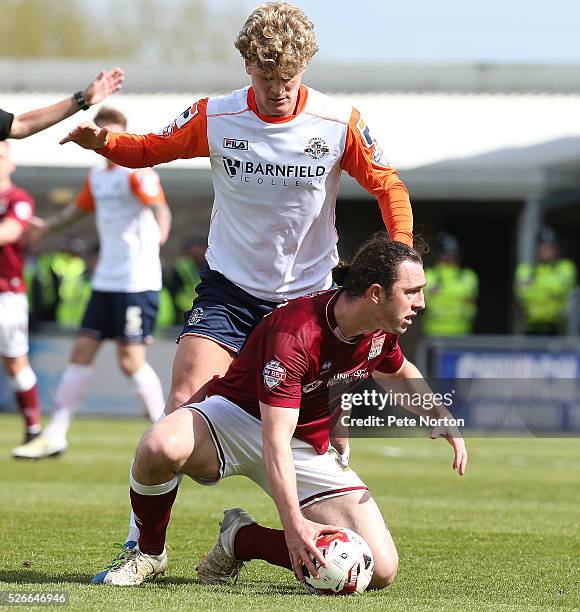 John-Joe O'Toole of Northampton Town under pressure from Cameron McGeehan of Luton Town during the Sky Bet League Two match between Northampton Town...