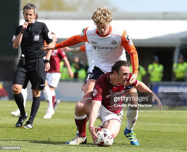 John-Joe O'Toole of Northampton Town under pressure from Cameron McGeehan of Luton Town during the Sky Bet League Two match between Northampton Town...