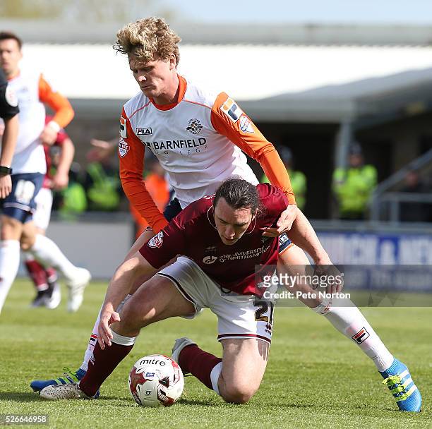 John-Joe O'Toole of Northampton Town under pressure from Cameron McGeehan of Luton Town during the Sky Bet League Two match between Northampton Town...