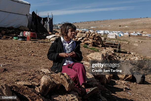 Yazidi girl plays in a camp for displaced persons on Mount Sinjar, Iraq, on November 15, 2015. The nearby town of Sinjar was re-captured from ISIS on...