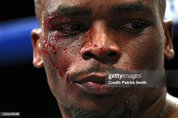 Sharif Bogere bleeds as he sits in his corner against Joshua Okine in their super lightweights bout at the DC Armory on April 30, 2016 in Washington,...