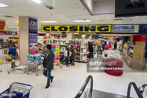 Customers search for bargains at the soon to be closing Sears store in the New York borough of the Bronx. Sears Holdings announced that third-quarter...