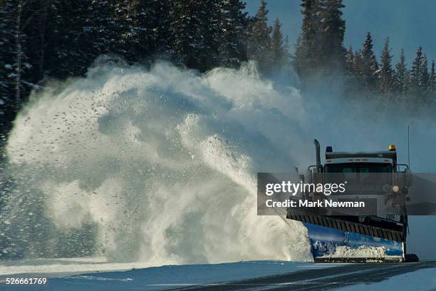 snowplow blowing snow off road - snow vehicle stock pictures, royalty-free photos & images