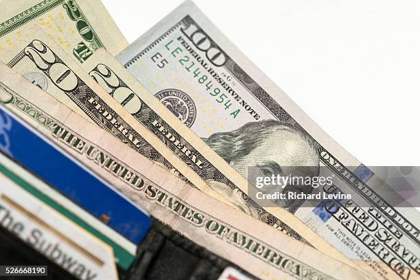 One hundred dollar bill with Benjamin Franklin is seen amongst other bills in New York on Friday, February 19, 2016. The U.S. Treasury Dept. Is...