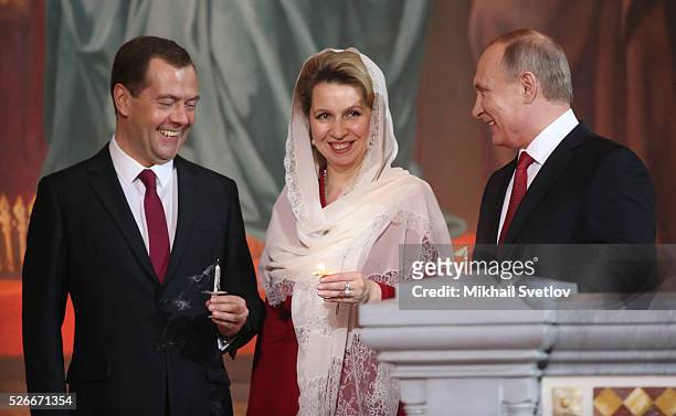 Russian President Vladimir Putin , Primier Dmitry Medvedev and his spouse Svetlana Medvedeva attend an Orthodox Easter mass at the Christ The Saviour...