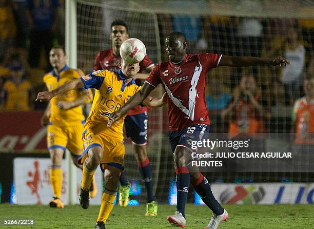 Israel Jimenez of Tigres vies for the ball with Cristian Martinez of Veracruz during the Mexican Clausura 2016 tournament football match at the...