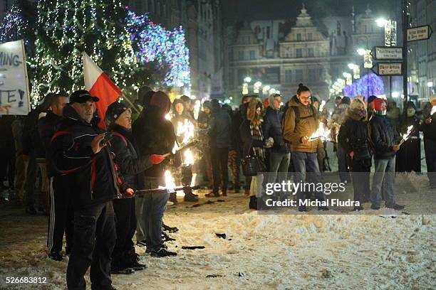 Anti-immigrants rally in Gdansk city centre. Dozen far-right activists from ONR and Mlodziez Wszechpolska organizations shouted racist slogans and...