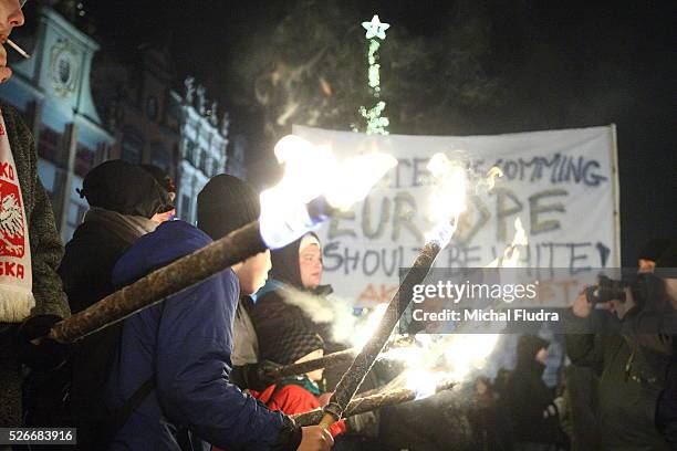 Anti-immigrants rally in Gdansk city centre. Dozen far-right activists from ONR and Mlodziez Wszechpolska organizations shouted racist slogans and...