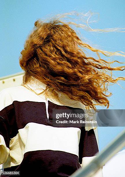 Chicago, Illinois Her wild mane of hair blowing around her face Chelsea Clinton walks down the steps from the campaign plane at Chicago's O'Hare...