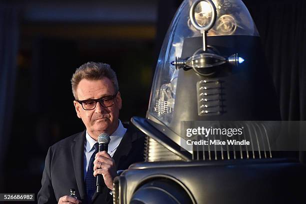 Actor Greg Proops and Robby the Robot attend 'Forbidden Planet' screening during day 3 of the TCM Classic Film Festival 2016 on April 30, 2016 in Los...
