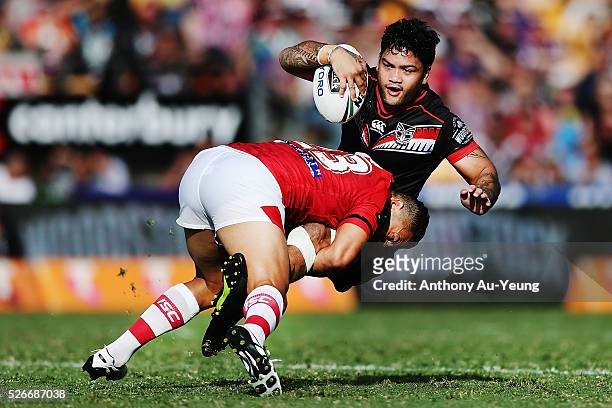 Issac Luke of the Warriors is tackled by Benji Marshall of the Dragons during the round nine NRL match between the New Zealand Warriors and the St...