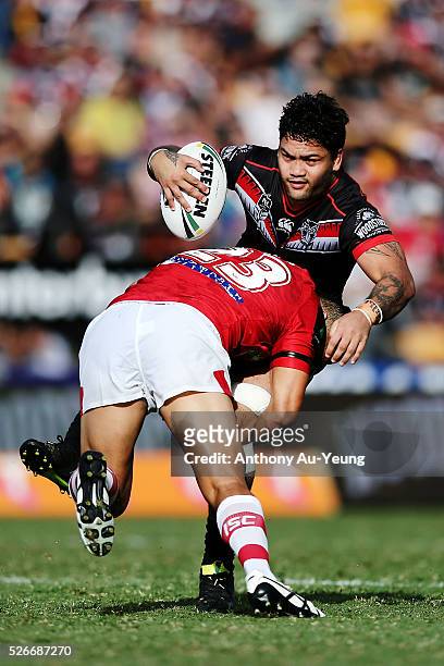 Issac Luke of the Warriors is tackled by Benji Marshall of the Dragons during the round nine NRL match between the New Zealand Warriors and the St...