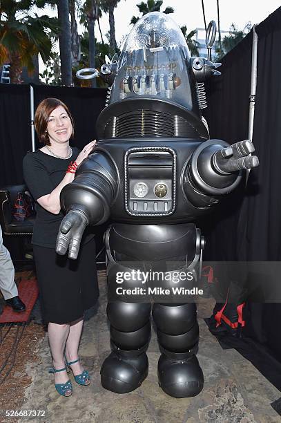 Managing Director of TCM Classic Film Festival Genevieve McGillicuddy and Robby the Robot attend 'Forbidden Planet' screening during day 3 of the TCM...