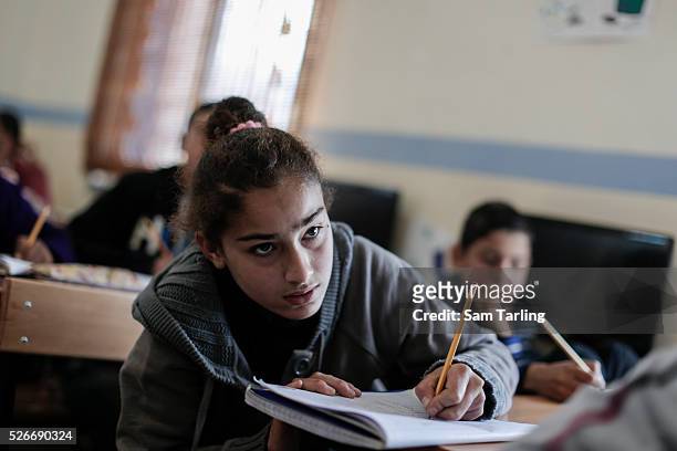 Tahaweed a Syrian refugee from the suburbs of Aleppo who fled fighting in the city three years ago, attends class at the Good Shepherd Sisters Center...