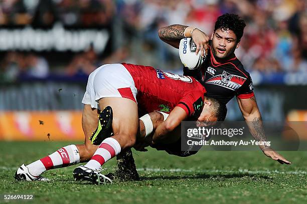 Issac Luke of the Warriors is tackled by Benji Marshall of the Dragons during the round nine NRL match between the New Zealand Warriors and the St...