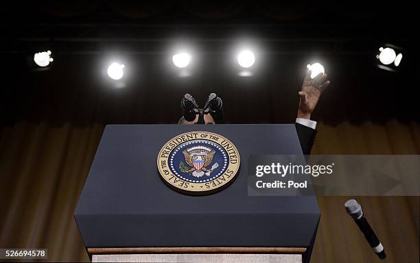 President Barack Obama drops the microphone after he speaks during the White House Correspondents' Association annual dinner on April 30, 2016 at the...