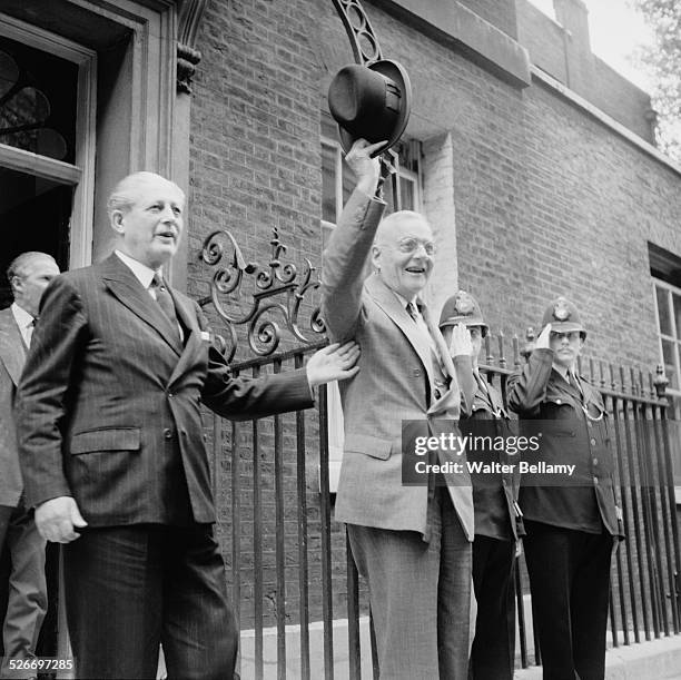 Secretary of State, John Foster Dulles waves to the crowd whilst on a visit to the Prime Minister of the United Kingdom, Harold Macmillan at 10...