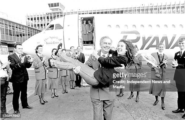 Ryanair's one millionth passenger Jane O'keeffe from Granville Avenue, Cabinteely in the arms of PJ McGoldrick Photographer Tom Burke. .