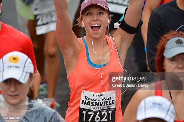 Runner Megan Ostrom crosses the finish line at the St. Jude Rock 'n' Roll Nashville Marathon/Half Marathon and 5k where more than 34,000 participants...