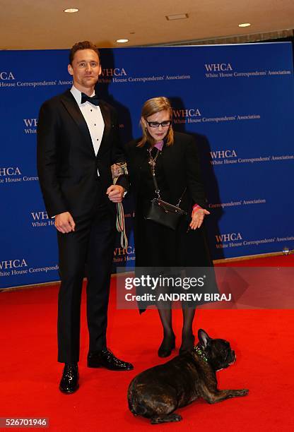 Actors Tom Hiddleston and Carrie Fisher with her dog Gary arrive for the 102nd White House Correspondents' Association Dinner in Washington, DC, on...