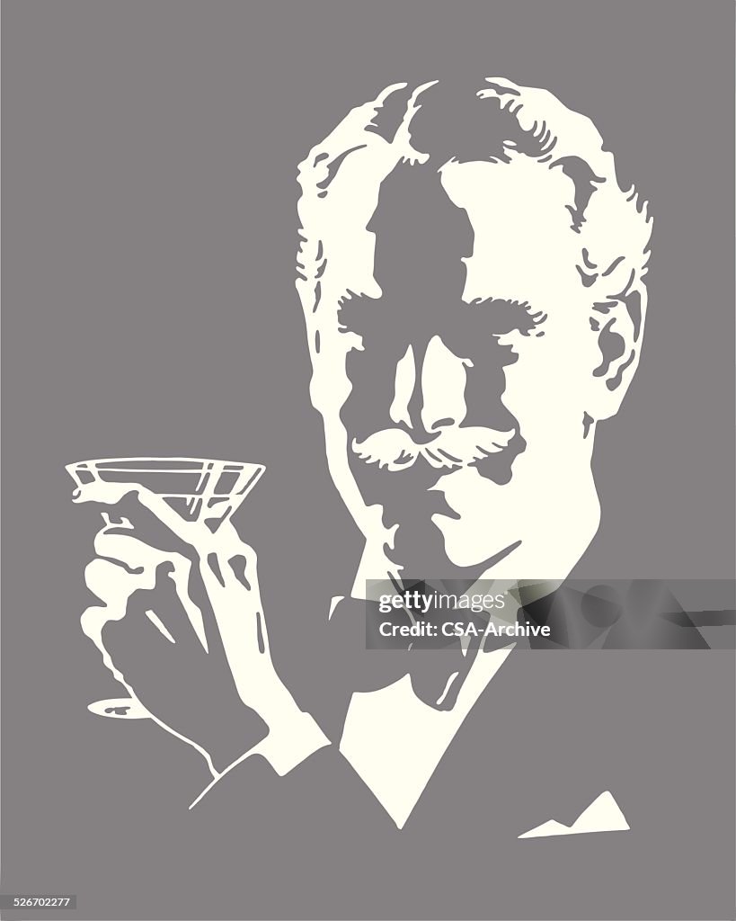 Man Wearing Bow Tie Holding Cocktail