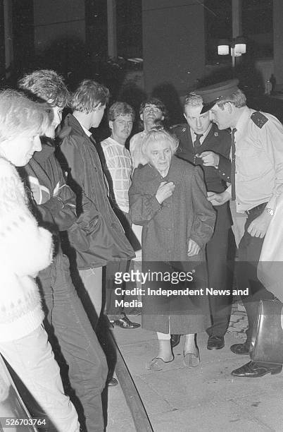 An elderly lady is taken from the scene at the fire last night in Loreto Convent St Stephens Green where six nuns perished. 2/6/86 Photographer Jim...