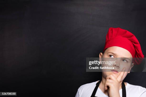 thinking child chef - kid chef stock pictures, royalty-free photos & images