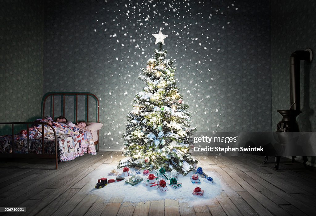 Christmas tree in child's bedroom with snow