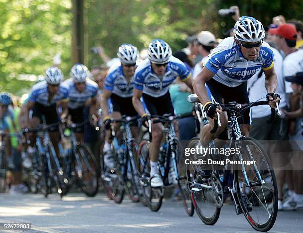 Viatcheslav Ekimov of Russia and leads the Discovery Channel Pro Cycling Team and the field up the first climb of Watchtower Hill as they enter the...