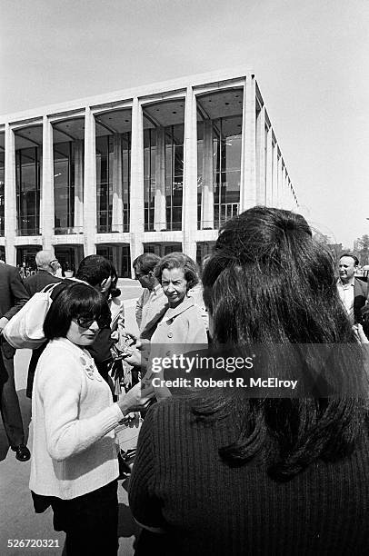 Filmmaker Agnes Varda, left, along with members and attendees of the New York Film Festival, wait for buses to transport them to Garnerville to visit...