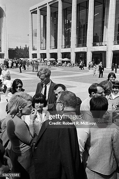 Film critic Annette Michelson, with cigarette, speaks with a group of members and attendees of the New York Film Festival, including filmmaker Agnes...