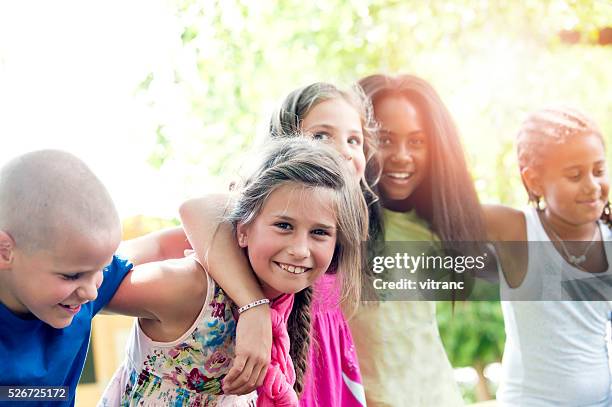 five happy children in summer - group arm in arm stock pictures, royalty-free photos & images