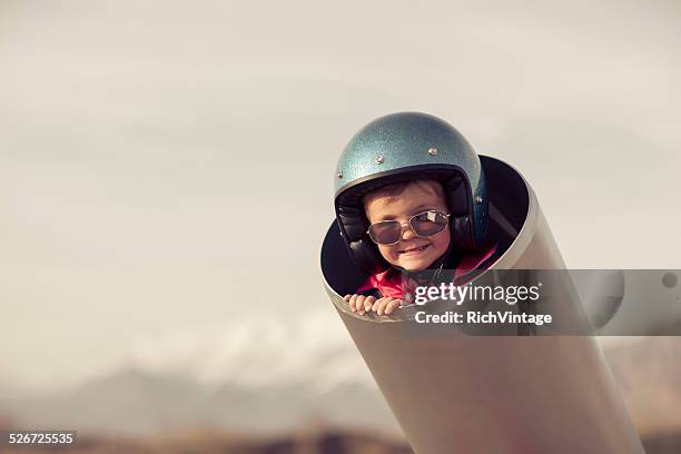 young boy is human cannonball in cannon - human cannon ball stock pictures, royalty-free photos & images