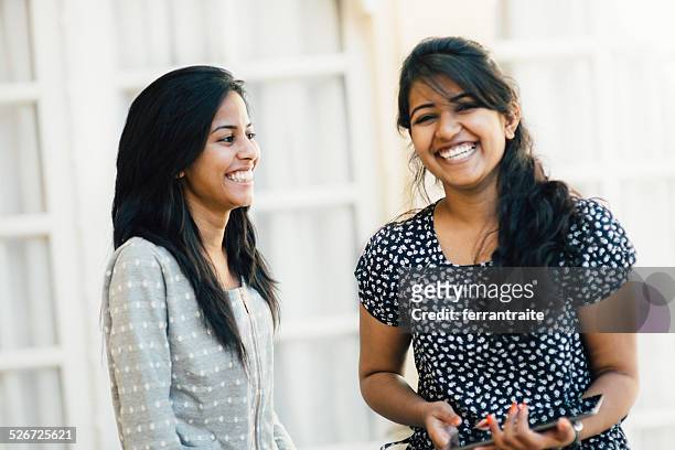 young indian female friends using digital tablet - beautiful college girls stock pictures, royalty-free photos & images