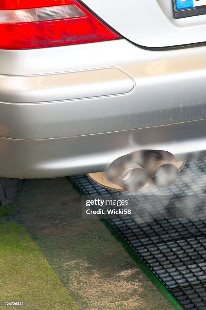 Smoldering exhaust of a Mercedes Benz Diesel