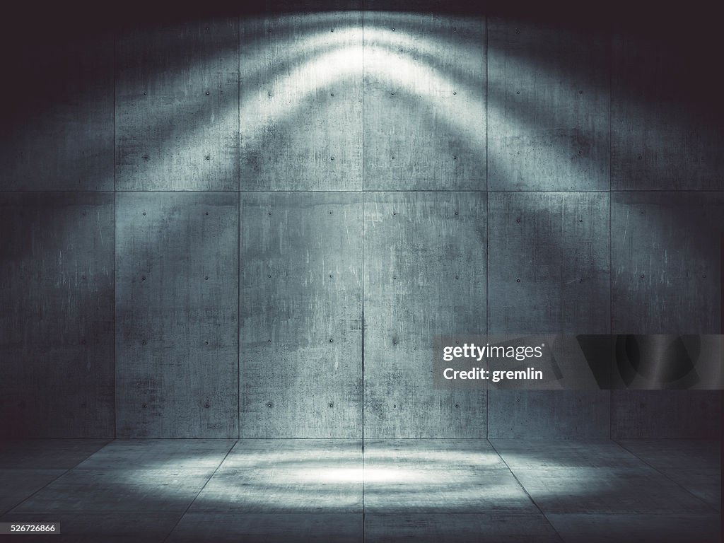 Dark concrete environment with top illumination