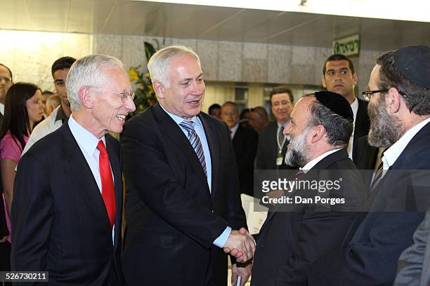 Prime Minister Binyamin Benjamin Netanyahu shaking hands with former deputy Finance Minister Yitzhak Cohen with Former Bank of Israel Governor,...