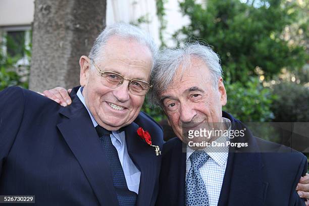 Elie Wiesel, 1986 Nobel Peace Prize Laureate, posing with his friend Joseph Ciechanover an Israeli diplomat and businessman who is wearing on his...