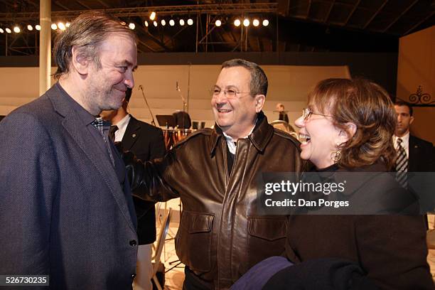 Russian conductor Valery Gergiev, talking and laughing on stage before a concert with General Ehud Barak, former Israel's Defense Minister and his...