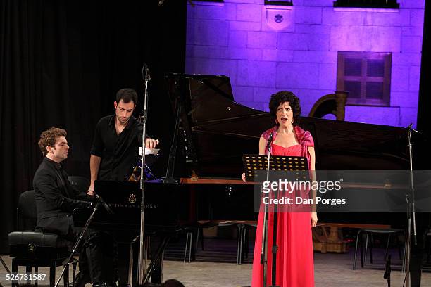 Mezzo soprano singer Ayelet Amots Avramson singing with pianist David Kadouch at the piano in concert in the Mary Nathaniel Golden Hall of Friendship...
