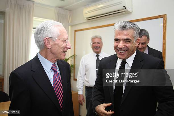 Professor Stanley Fischer, Governor of the Bank of Israel talking and laughing with Finance Minister Yair Lapid in the Finance Ministry, Jerusalem,...