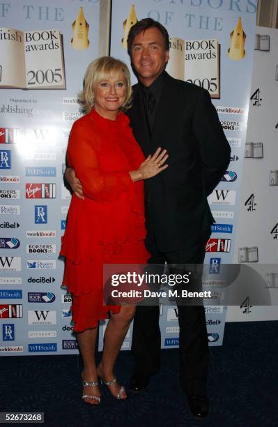 Talk show hosts Judy Finnigan and husband Richard Madeley of "Richard & Judy" pose in the Awards Room during the annual British Book Awards at...