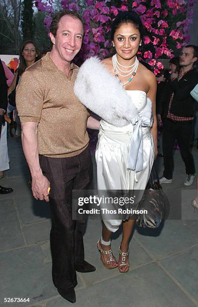 Tom Silver and Donna D' Cruz attend the "H&M Live From Central Park" fashion show April 20, 2005 in New York City.