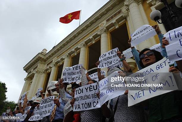 Vietnamese protesters demonstrate against Taiwanese conglomerate Formosa during a rally in downtown Hanoi on May 1, 2016. Around a thousand people...