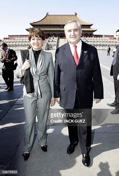 French Prime Minister Jean-Pierre Raffarin and his wife Anne-Marie pose during a visit to the inauguration of the Louis XIV exposition at the...
