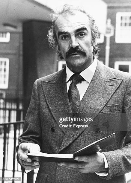 'James Bond' actor Sean Connery greeting reporters outside a London Divorce Court, October 5th 1973.