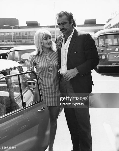 'James Bond' actor Sean Connery and his wife Diane Cilento getting into their car at Heathrow Airport, London, July 7th 1967.