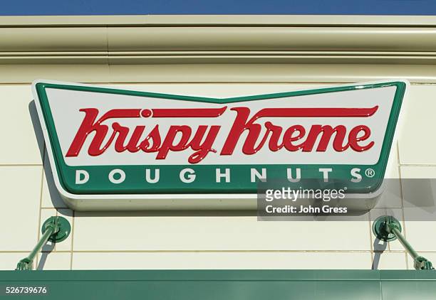 Krispy Kreme logo sign is shown in in Beaverton, Oregon. Krispy Kreme is under a formal SEC investigation of its franchise buybacks and earnings...