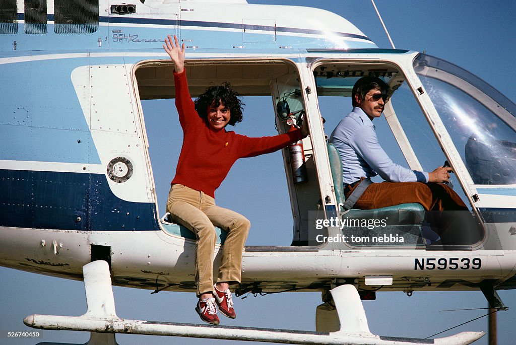 Stunt Performer Waving from Helicopter